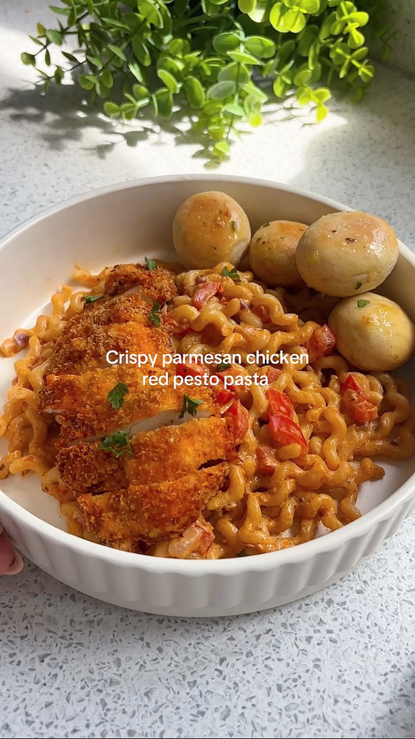 Crispy parmesan chicken red pesto pasta with dough balls